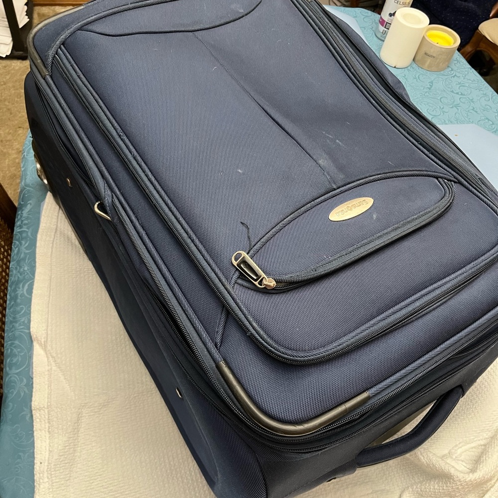Full size blue Samsonite suitcase. No problems or defects.